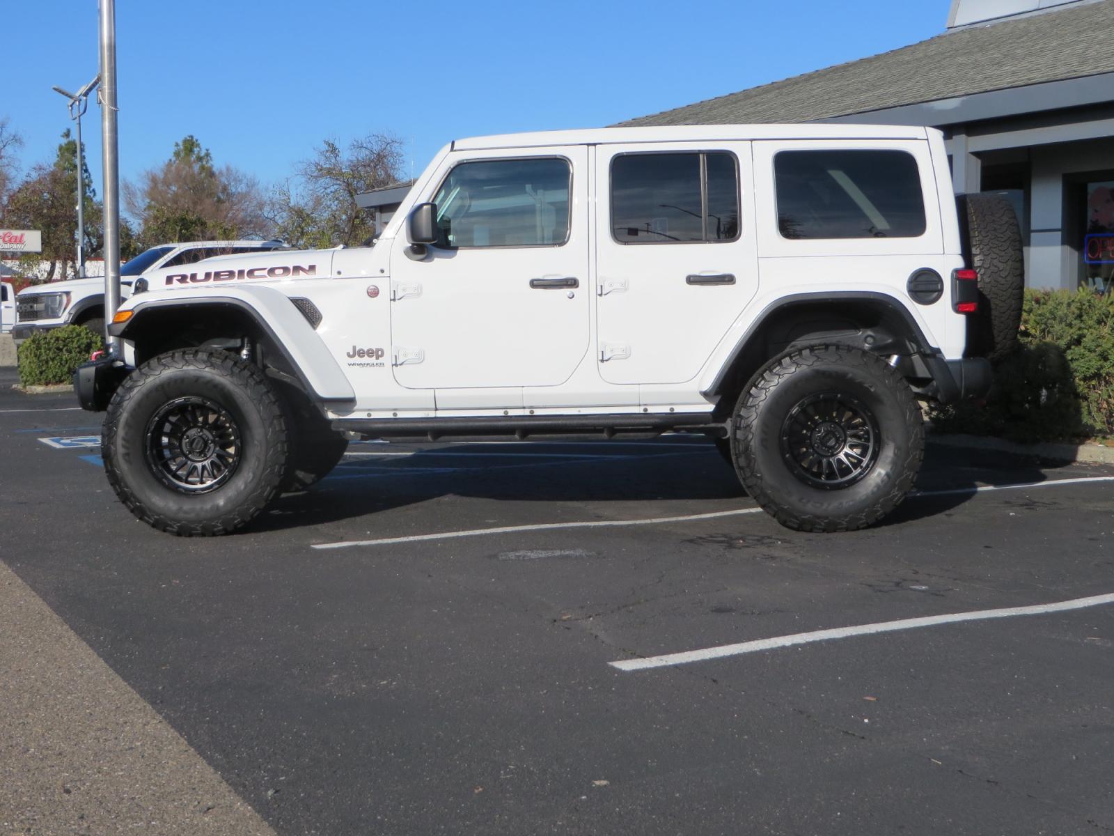 2020 White /TAN Jeep Wrangler Unlimited Rubicon (1C4HJXFG8LW) with an 3.6L V6 DOHC 24V FFV engine, 6A transmission, located at 2630 Grass Valley Highway, Auburn, CA, 95603, (530) 508-5100, 38.937893, -121.095482 - 3" Zone offroad suspension system, Fox adventure series shocks, rocksliders, Teraflex HD tire relocation, Mopar HD tailgate hinge, 17" KMC wheels, and 37" BFG KO2 tires. - Photo #7